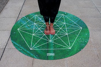 Person Standing on Green Round Mat