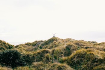 Person Standing on Hill