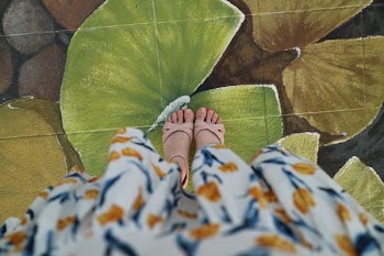 person standing on leaf painting flooring