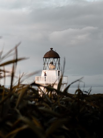 Person Standing On Lighthouse
