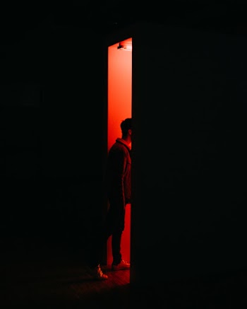 Person Standing on Opened Doorway