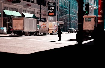 Person Standing On Pedestrian Lane