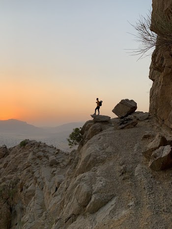Person Standing on Rock 