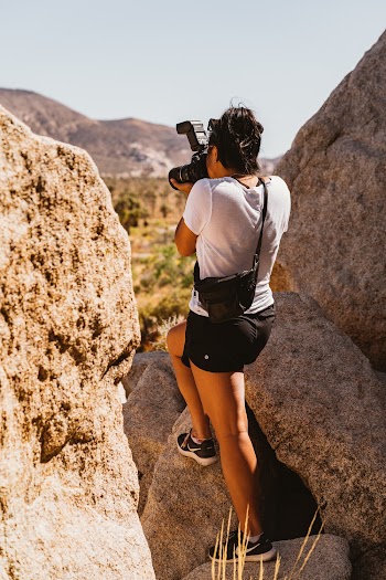 Person Standing on Rock