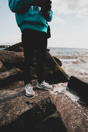 Person Standing on Rock