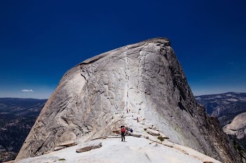 person standing on rock formation