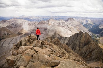 Person Standing on Rock Mountain