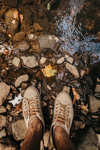 Person Standing On Rocks