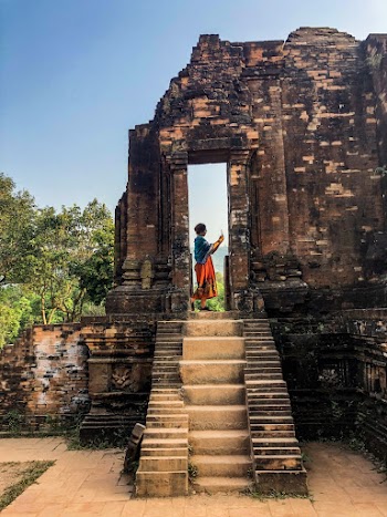 Person Standing on Ruined Building