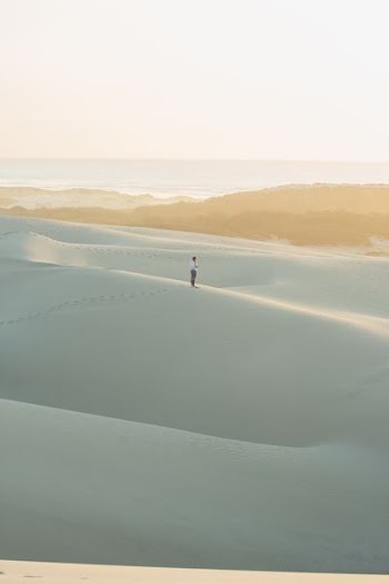 person standing on sand