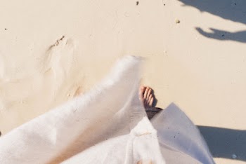 Person Standing on Sand