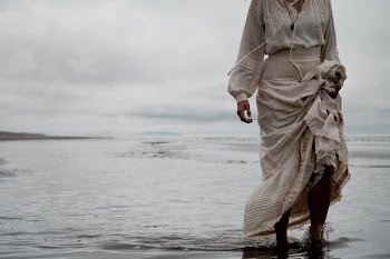 person standing on sea shore