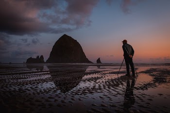 Person Standing on Seashore