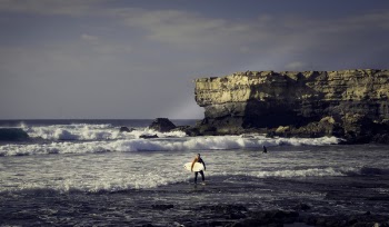 Person Standing on Shore