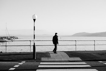 Person Standing on Sidewalk