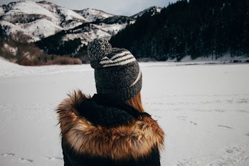 person standing on snow-covered field