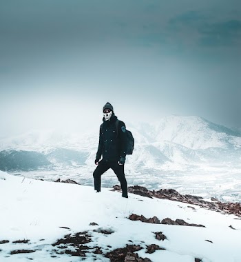 Person Standing on Snowy Area