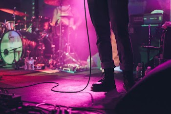 Person Standing On Stage