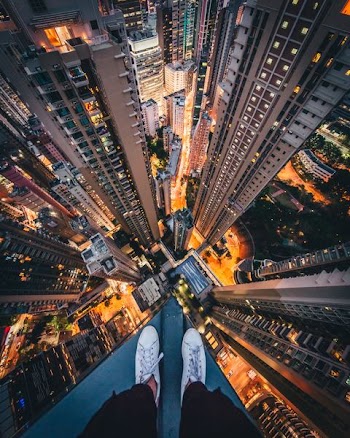 person standing on top of high-rise building