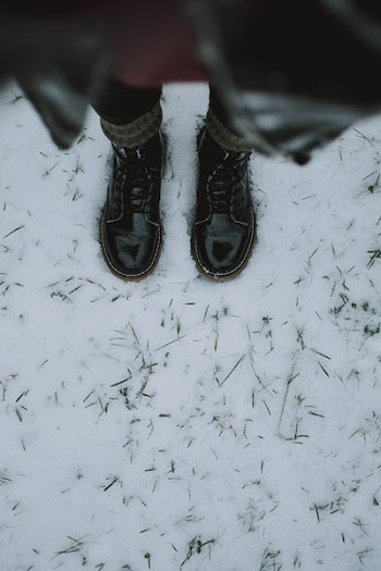 Person Standing on White Snowfield