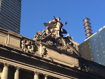 Person Standing Raising Two Hands Statue