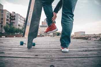 person standing while rising his leg