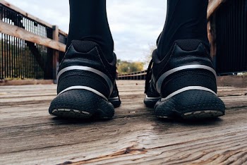 Person Stands on Wooden Platform