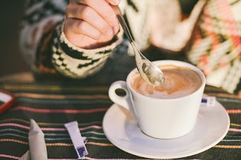 Person Stirring Cappuccino