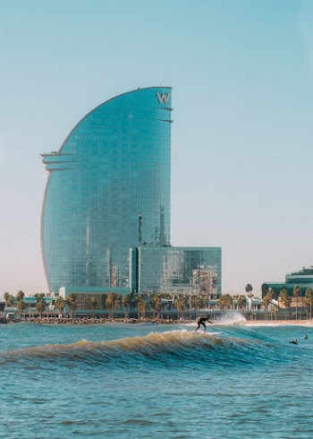 Person Surfing On Sea