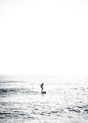 Person Surfing On Sea 