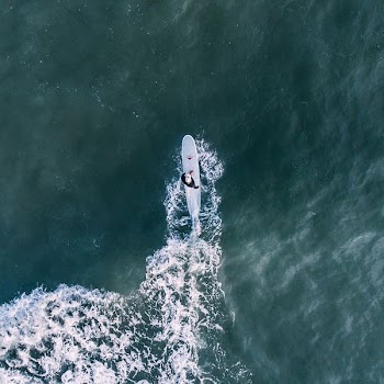 person surfing under sunny sky