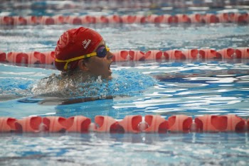 Person Swimming in Pool