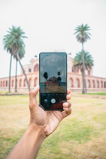 Person Taking A Photo Using Smartphone
