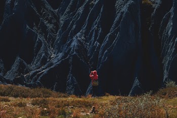 Person Taking Photo of a Mountain