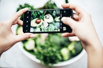Person Taking Photo Of Bowl Of Vegetables