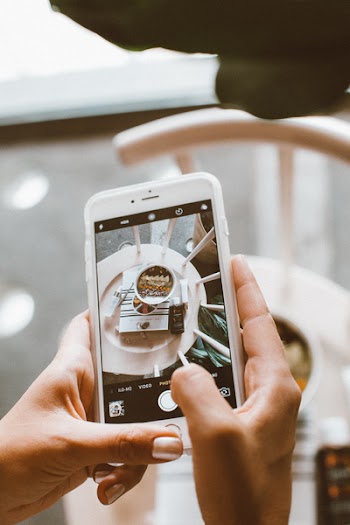 Person Taking Photo of Bowl Using Iphone