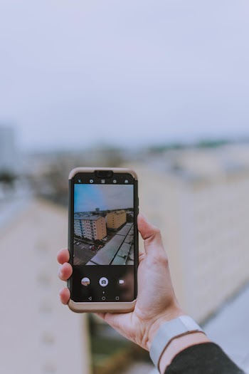 Person Taking Photo of Building 