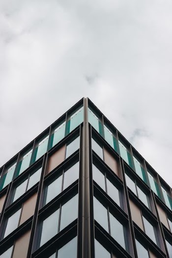 person taking photo of building