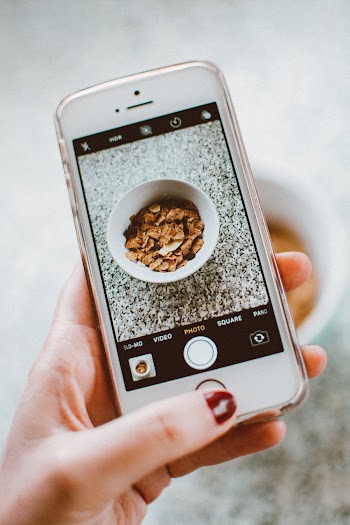 Person Taking Photo Of Cereals