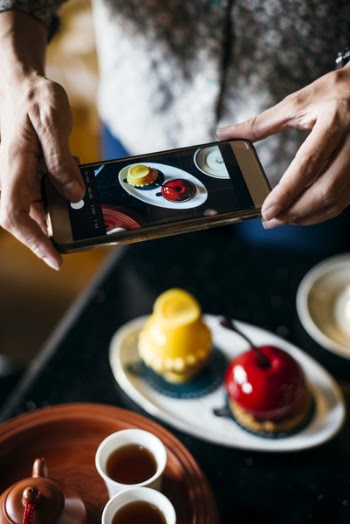 Person Taking Photo Of Food