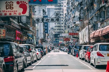 person taking photo of road with cars during daytime