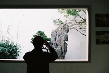 Person Taking Photo of Rock Formation