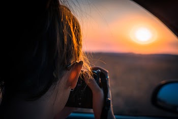 Person Taking Photo of Sun