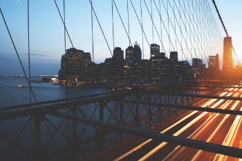 Person Taking Photo of Suspension Bridge