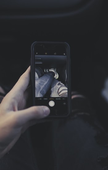 Person Taking Photo Using Smartphone
