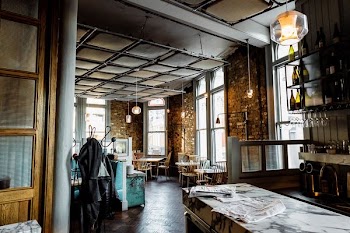 person taking picture inside the restaurant