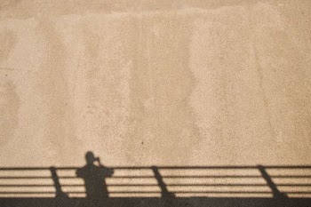 person taking picture of the shadow
