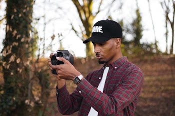 person taking picture using camera