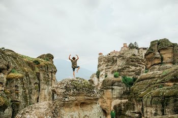 person taking yoga during daytime