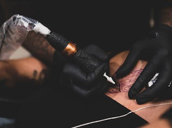 Person Tattooing Person Body
